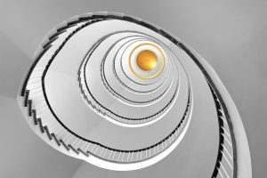 Stress, headache, illness. Upset mixed race woman sitting on a sofa in living room with eyes closed, suffering headache, vertigo, migraine, having a cramp in a temples, needs treatment and rest