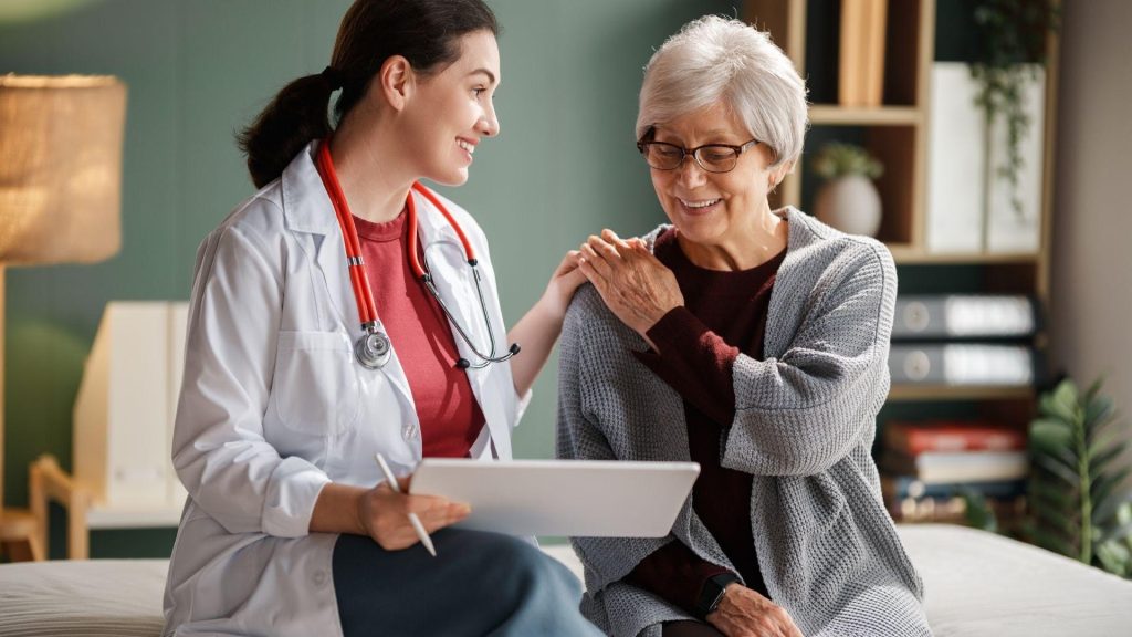 Integrative Cancer Treatment: How Complementary Therapies May Support Patients During and After Cancer Care 5 Doctor discussing integrative cancer treatment and complementary therapies with an elderly cancer patient during a supportive oncology consultation
