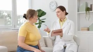 Doctor discussing high-dose vitamin C as an integrative cancer therapy with a patient during a medical consultation.